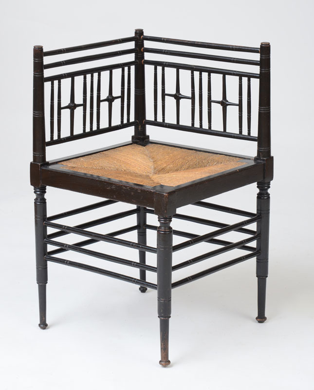 ENGLISH AESTHETIC MOVEMENT EBONIZED BEECH AND RUSH SEAT CORNER CHAIR, AFTER FORD MADDOX BROWN FOR LIBERTY & CO.