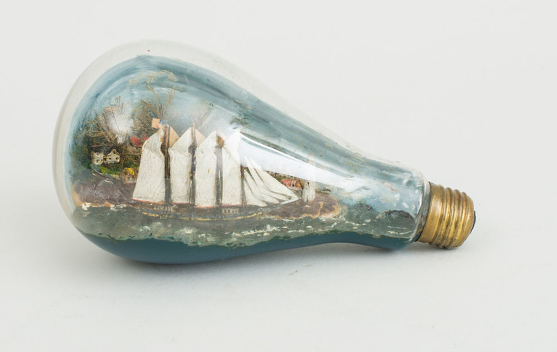 CARVED AND PAINTED SCHOONER MODEL, IN A GLASS LIGHT BULB