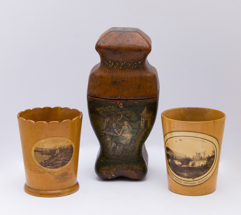 TWO SOUVENIR TREEN CUPS AND A PAINTED LEATHER CASE