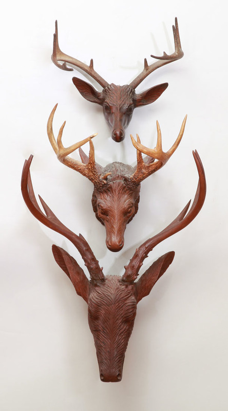 GROUP OF THREE CARVED WOOD STAG TROPHIES