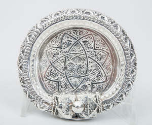 Eight North African Silver-Plated Bracelets Mounted as Dishes