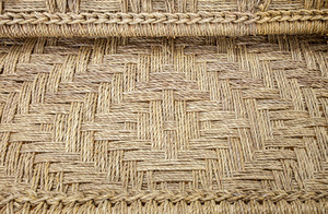 PAIR OF WOVEN GRASS CORD AND TURNED WOOD SETTEES