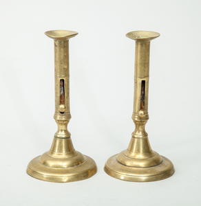 PAIR OF GEORGE III BRASS PUSH-UP CANDLESTICKS