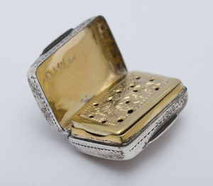 GEORGE III SILVER SMALL VINAIGRETTE IN THE FORM OF A CASE, A LATER GEORGE III VINAIGRETTE AND A WILLIAM IV VINAIGRETTE