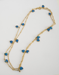 Five Gilt-Metal and Colored Glass or Simulated Lapis Lazuli Long Chains