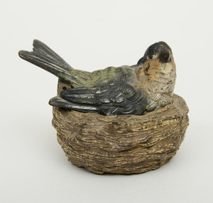 CONTINENTAL COLD PAINTED BRONZE BIRD SITTING ON A NEST, POSSIBLY AUSTRIAN