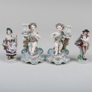 Pair of Chelsea Style Porcelain Figural Candlesticks and a Pair of Sitzendorf Style Porcelain Figures