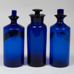 Three Blue Glass  Apothecary Jars and a Pair of Steuben Glass Jars and Covers