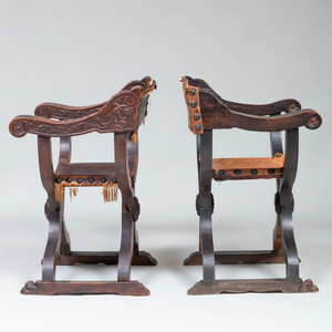 Two Italian Carved Walnut and Leather Curule Chairs