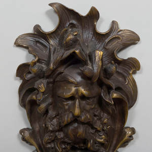 Pair of Rococo Style Bronze Figural Single-Light Wall Sconces