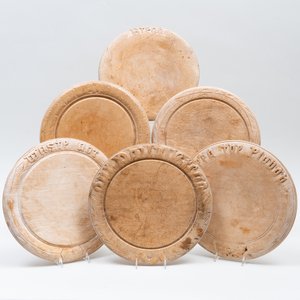Carved Wood Plate Rack, a Group of Wood Trenchers, and a Group of Bread Boards